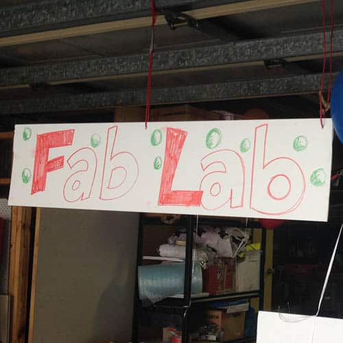 Fab lab sign hanging in a garage
