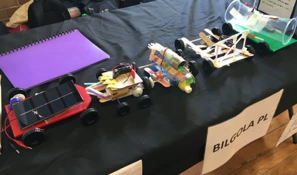 Variety of powered cars displayed on a black table
