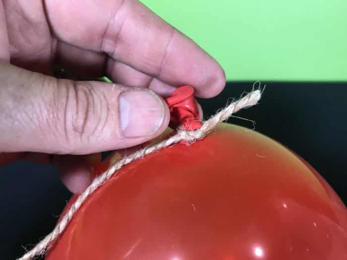 Blow em apart science experiment - string tied to a red balloon
