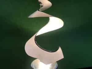 Convection spiral science experiment - spiral paper hanging over the spotlight