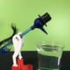 Drinking bird science experiment - drinking bird starting to bend over