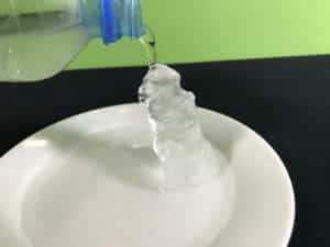 Supercool water science experiment - ice tower formed