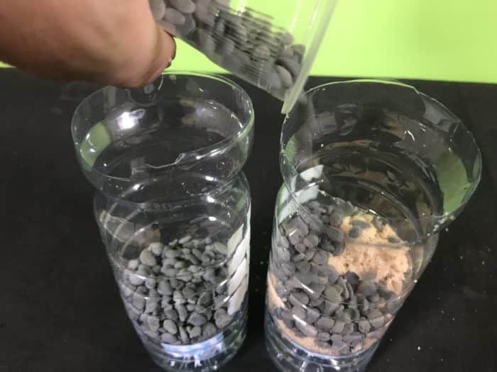 Create a water filter science experiment - adding gravel to a filter