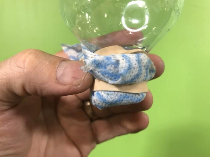 Create a water filter science experiment - cloth tied at the end of the bottle