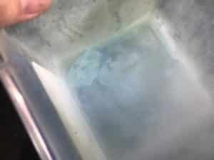 Create ice cores with dry ice experiment - dry ice stuck to bottom of container