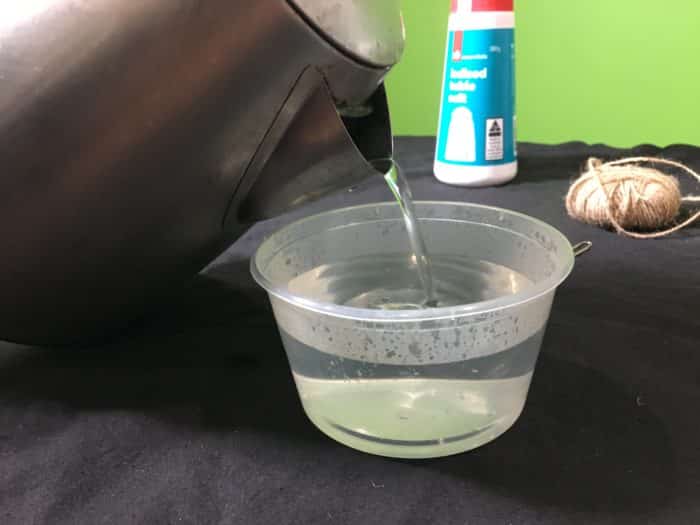 pouring hot water into a container