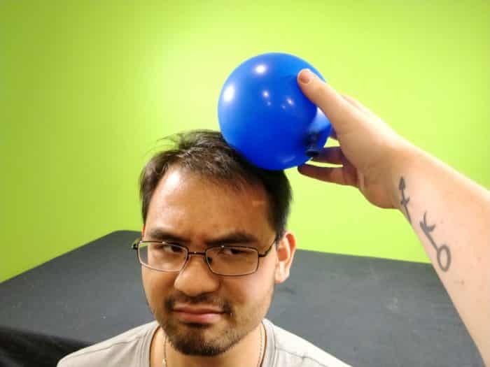 The Soda Can Attractor - rub the balloon vigorously on your volunteer_s head