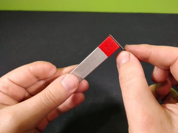 Rubbing a needle on a magnet