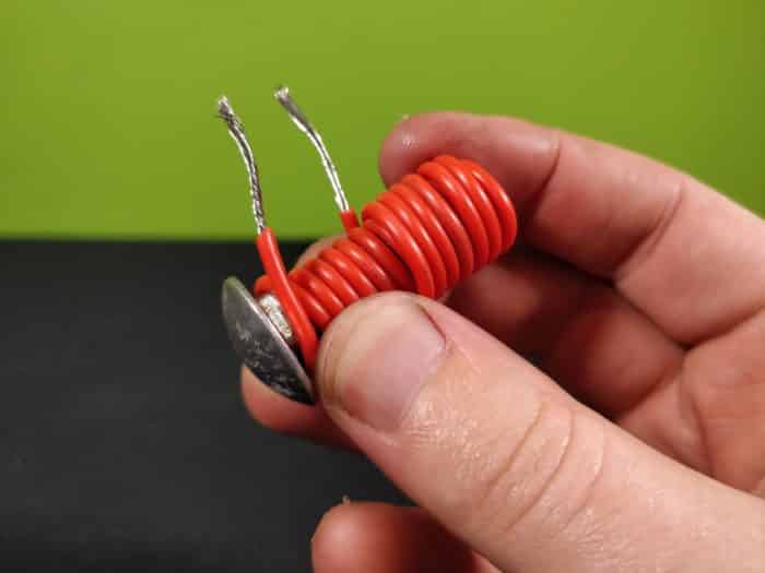 Wrapping insulated wire around a steel bolt