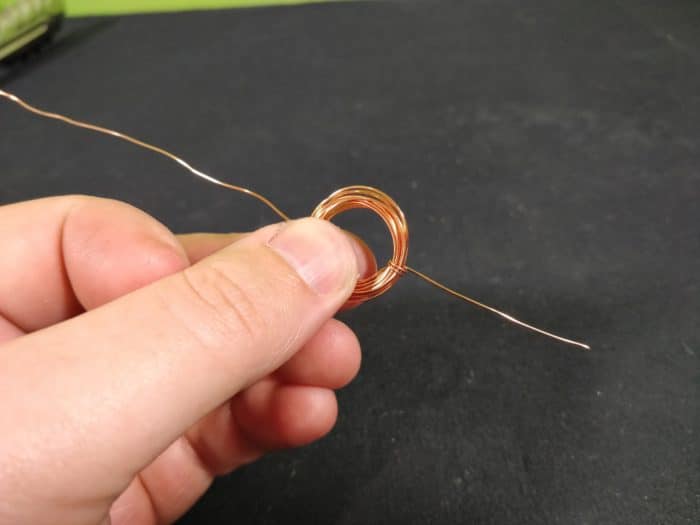 Make a Simple Motor - remove coil of copper and wrap one loose end around coil to keep tight