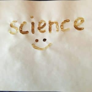 Lemon juice Christmas cards science experiment - lemon juice writing after applying heat