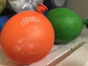 Why is an iceberg frozen and not water below science experiment - balloons in the freezer