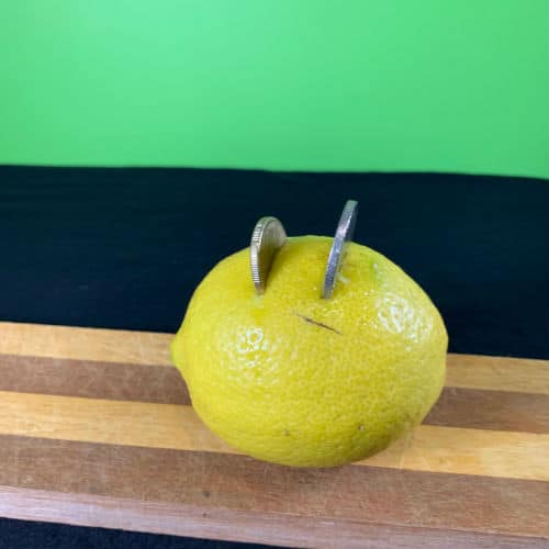 A simple Homemade Lemon Battery - add the coins to the lemons holes