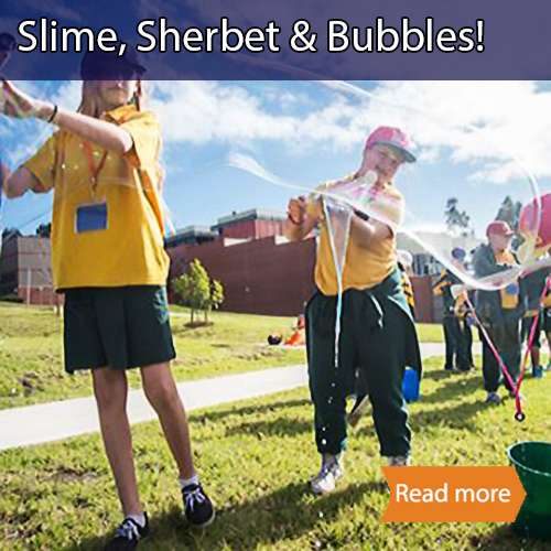 Slime sherbet bubbles school science visit tile showing students in yellow uniforms making giant bubbles