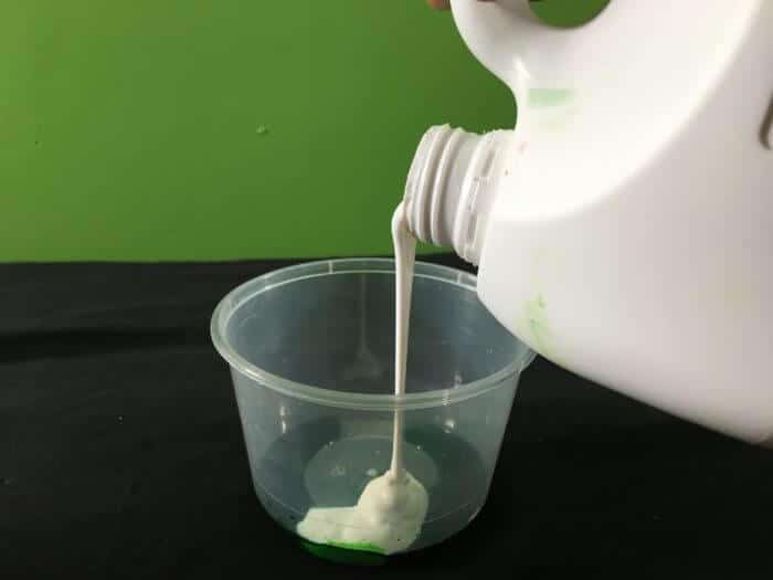 PVA Glue and Borax slime science experiment variant - pouring PVA glue into plastic container
