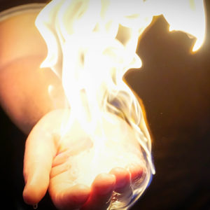 hand with flame around it without injury