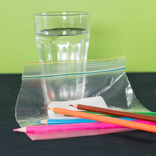 Leak proof bag experiment materials - 3 pencils, a cup of water and a zip lock bag