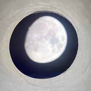Moon shown inside a cardboard tube