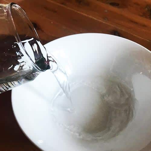Pouring water into a bowl
