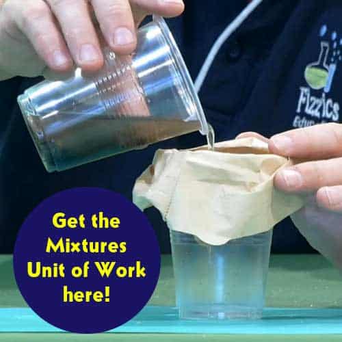 Pouring a dirty water mixture in a clear plastic cup into another clear plastic cup that has a simple paper filter across its top (held in place by a rubber band)