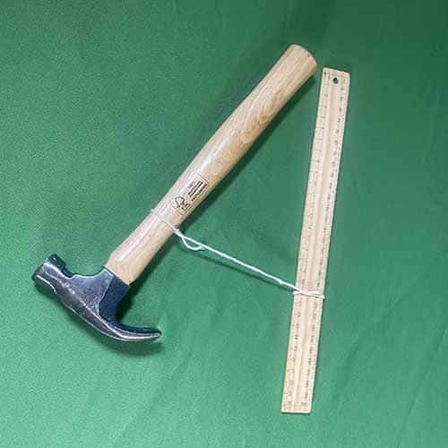Hammer and ruller tiied together with string