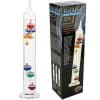 Galileo thermometer 28cm next to the box . There are three coloured balls at the top of the thermometer and three coloured balls at the bottom of the thermometer.