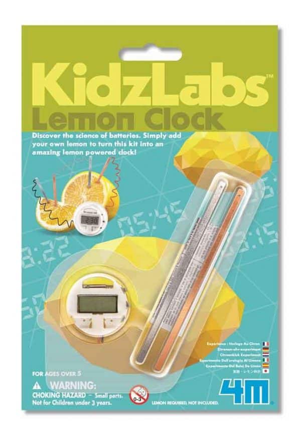 A lemon clock inside the packaging. There is a picture of a lemon connected to the LCD watch