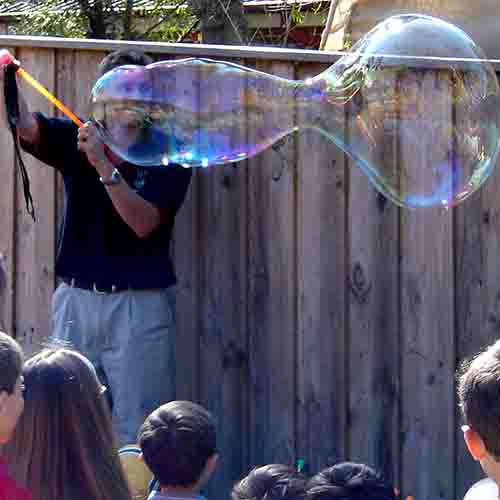 Ben Newsome making a giant bubble
